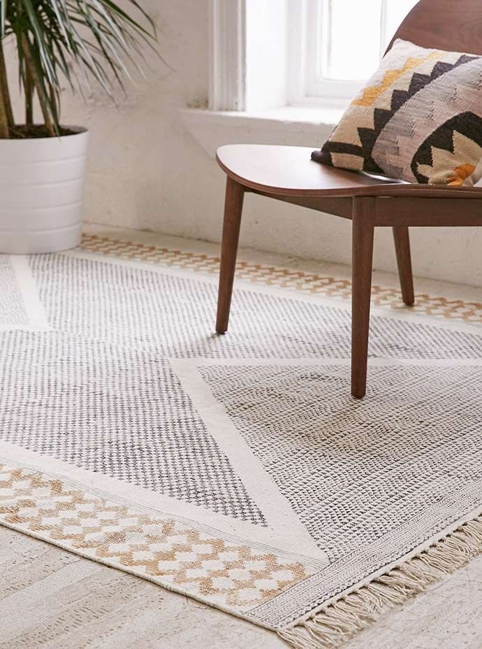 Clean modern living room with rug and wooden flooring maintained by professional cleaning in Melbourne