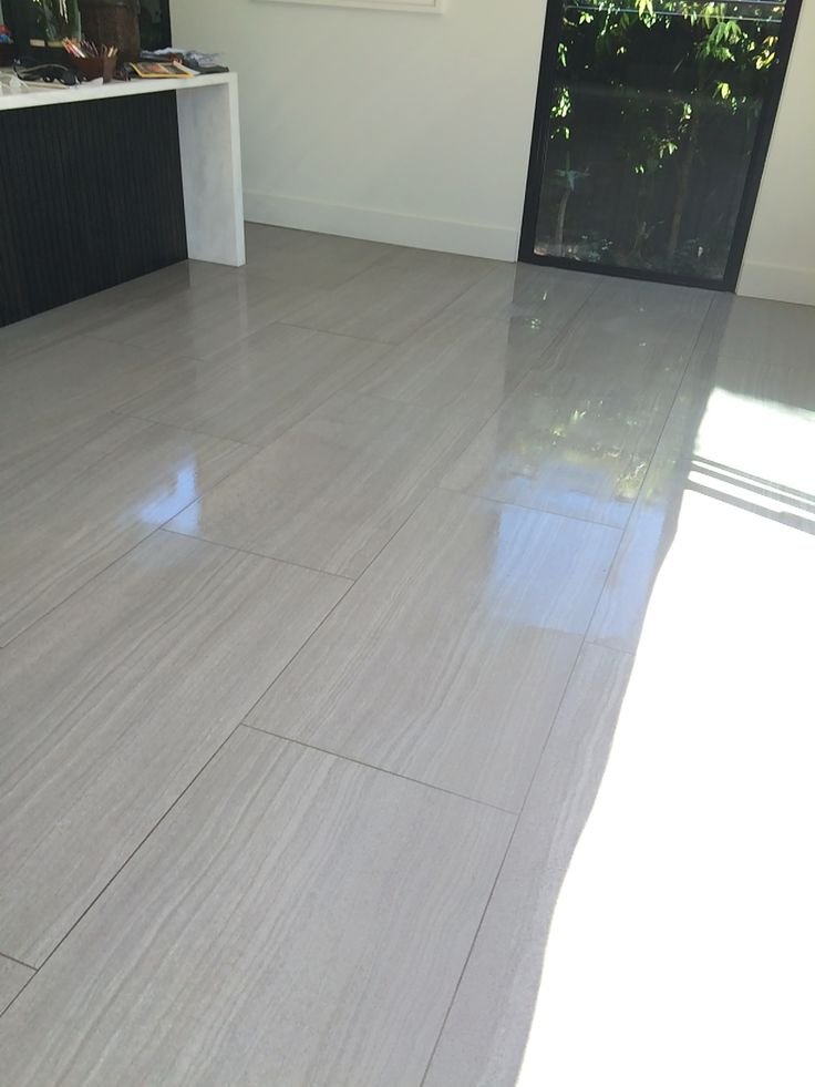 Clean polished tiled floor reflecting sunlight after professional tile cleaning in Melbourne